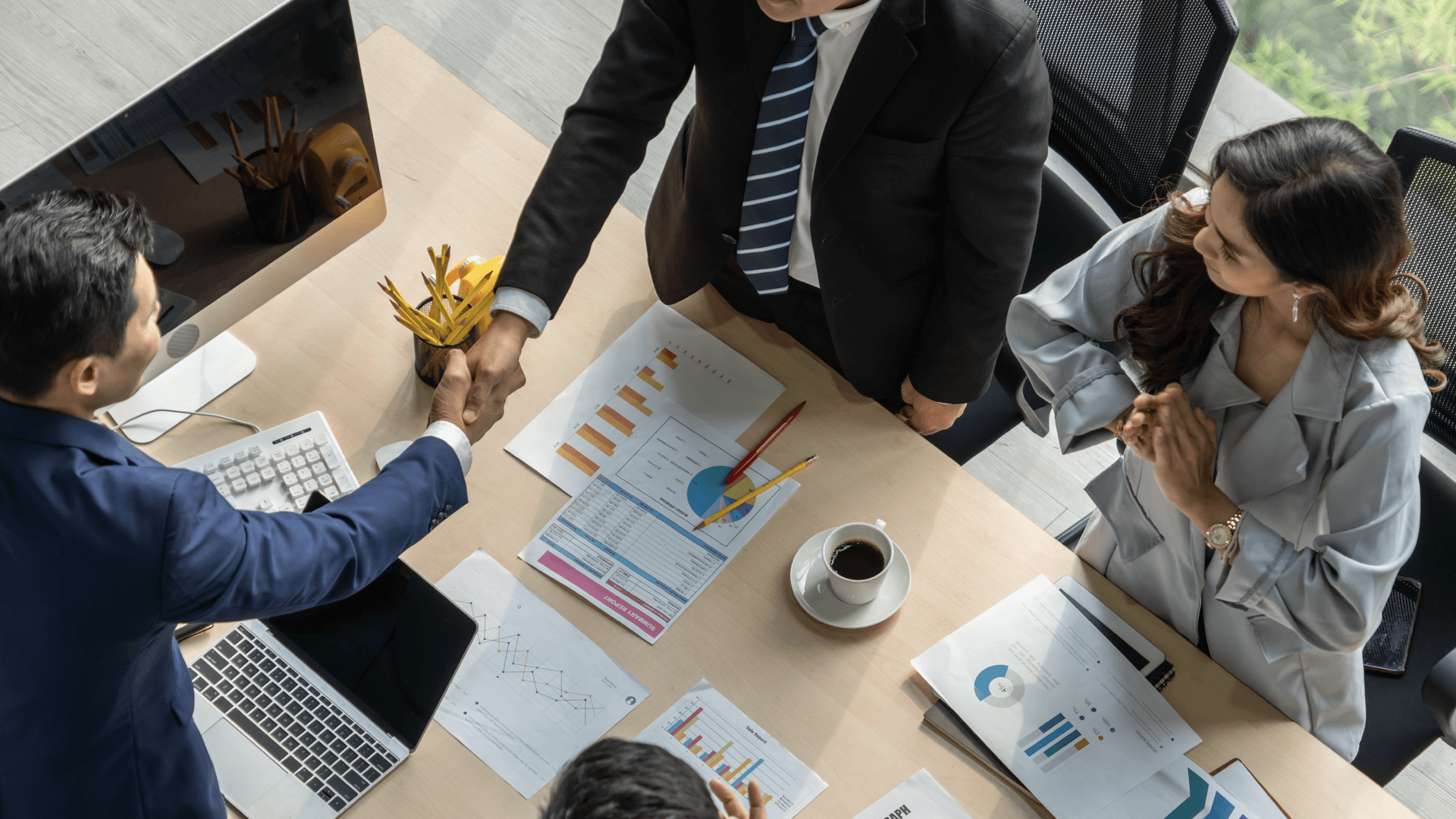 Professionals shaking hands in a meeting